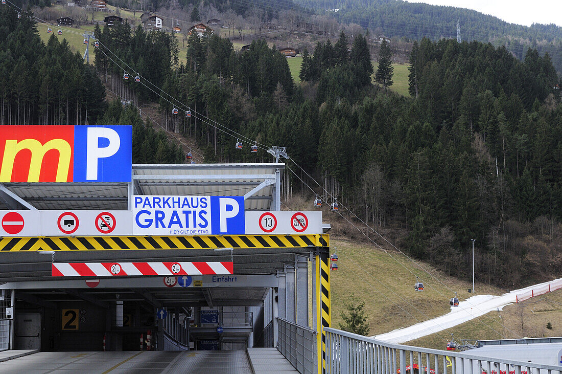 Parking deck and skiing area with artificial snow in the background, Zillertal skiing area, Zillertal valley, Tyrol, Austria