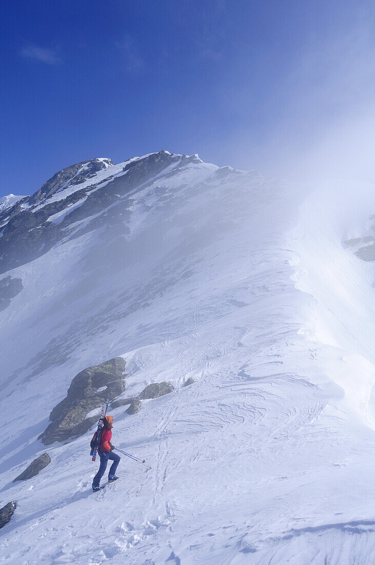 Woman ascending to mount Rotes Beil, Pfitschertal, Zillertal Alps, South Tyrol, Trentino-Alto Adige/Südtirol, Italy