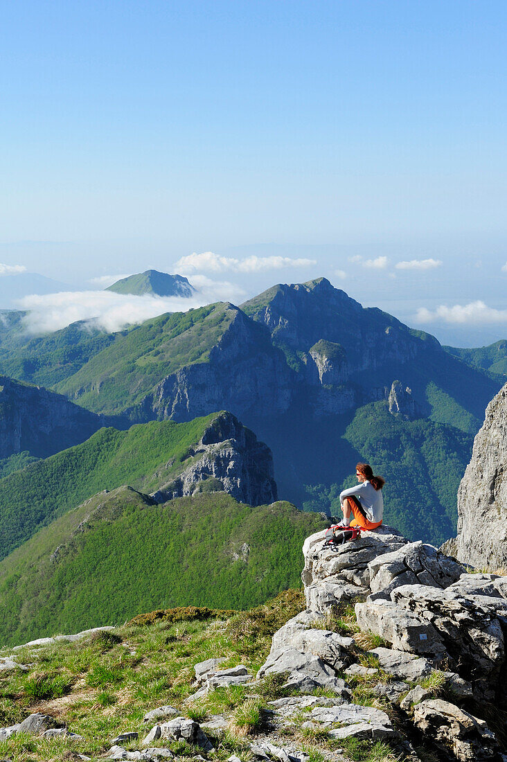 Woman enjoying view over Alpi Apuane, Rifugio Rossi, Pania della Croce, Tuscany, Italy