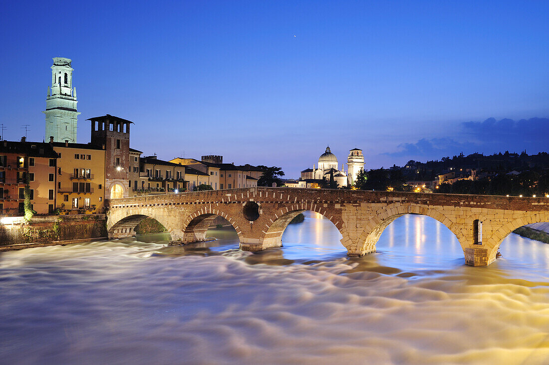 Illuminated bridge Ponte Pietra in the evening light, UNESCO World Heritage Site, Verona, Venetia, Italy