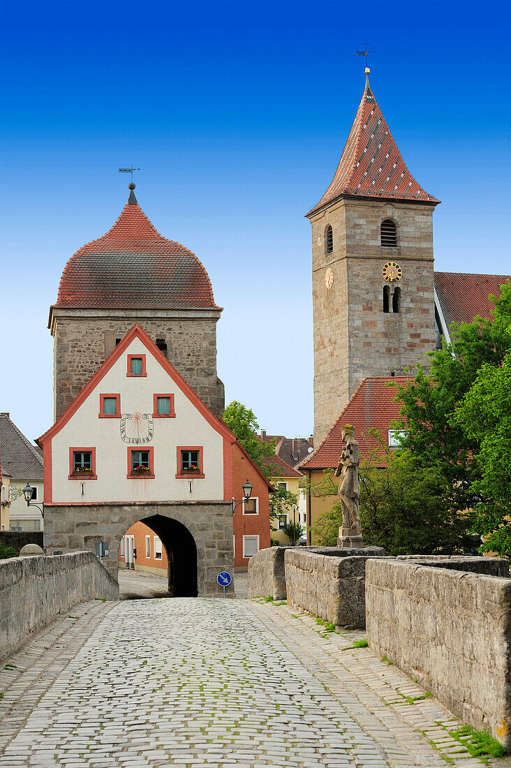 Bridge with city gate and church spire, Altmuehltal cycle trail, Altmuehl valley, Ornbau, Ansbach, Bavaria, Germany