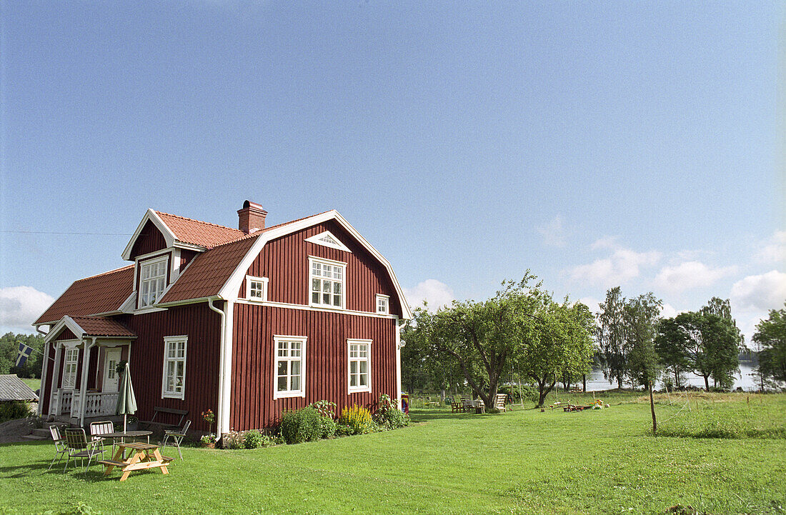 Countryside with red wooden cottage, Smaland, Sweden, Europe