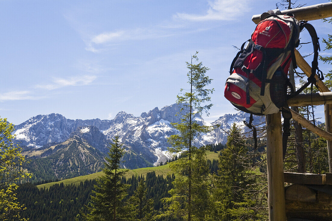 Mountain panorama with rucksack on Vorderskopf, view towards Wetterstein mountains, Alps, Austria, Europe