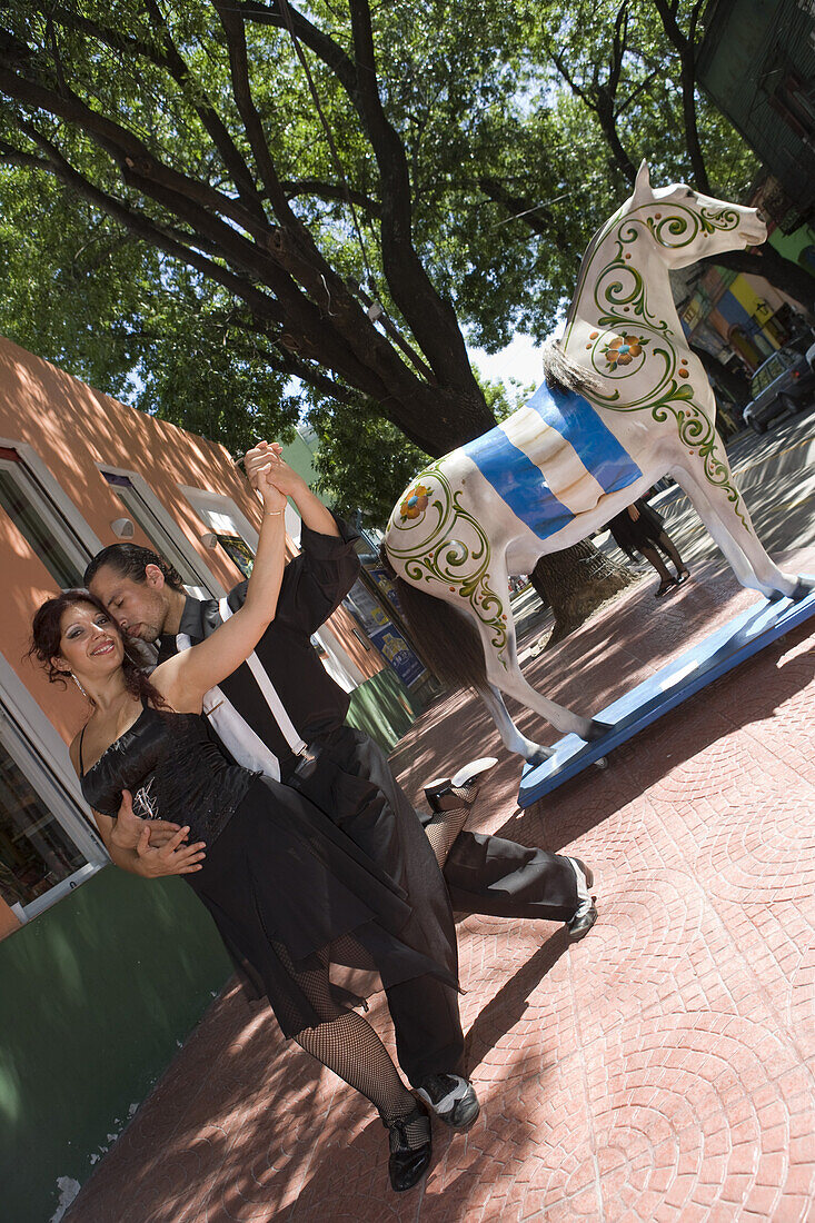 Tango dancers in streets of La Boca district, Buenos Aires, Argentina, South America, America