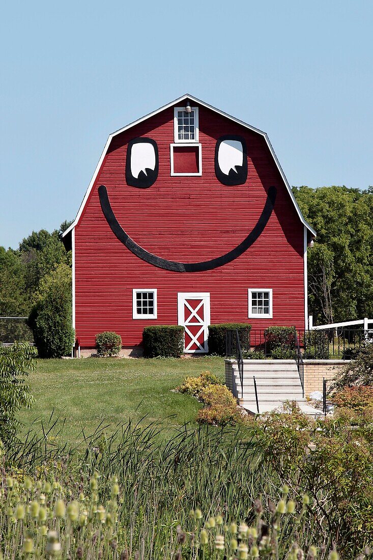 Smiley face barn beside rural home in Southern Wisconsin