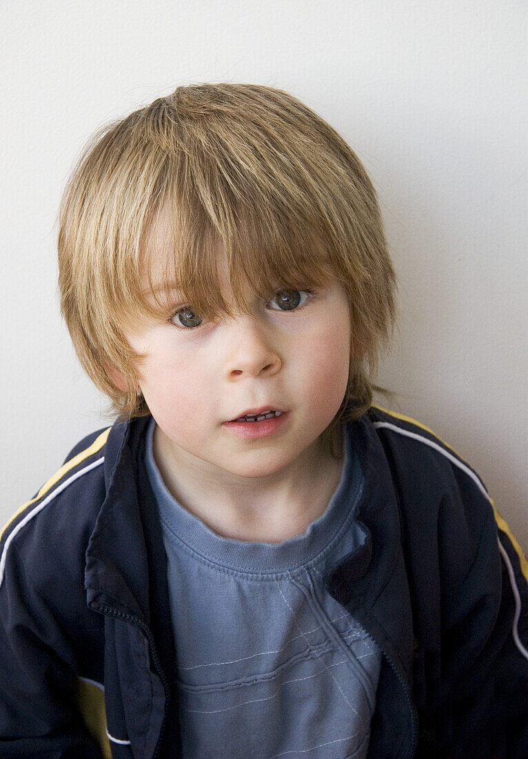 Portrait of a boy with a surprised expression