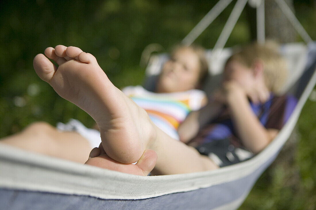 Boy and girl in hammock