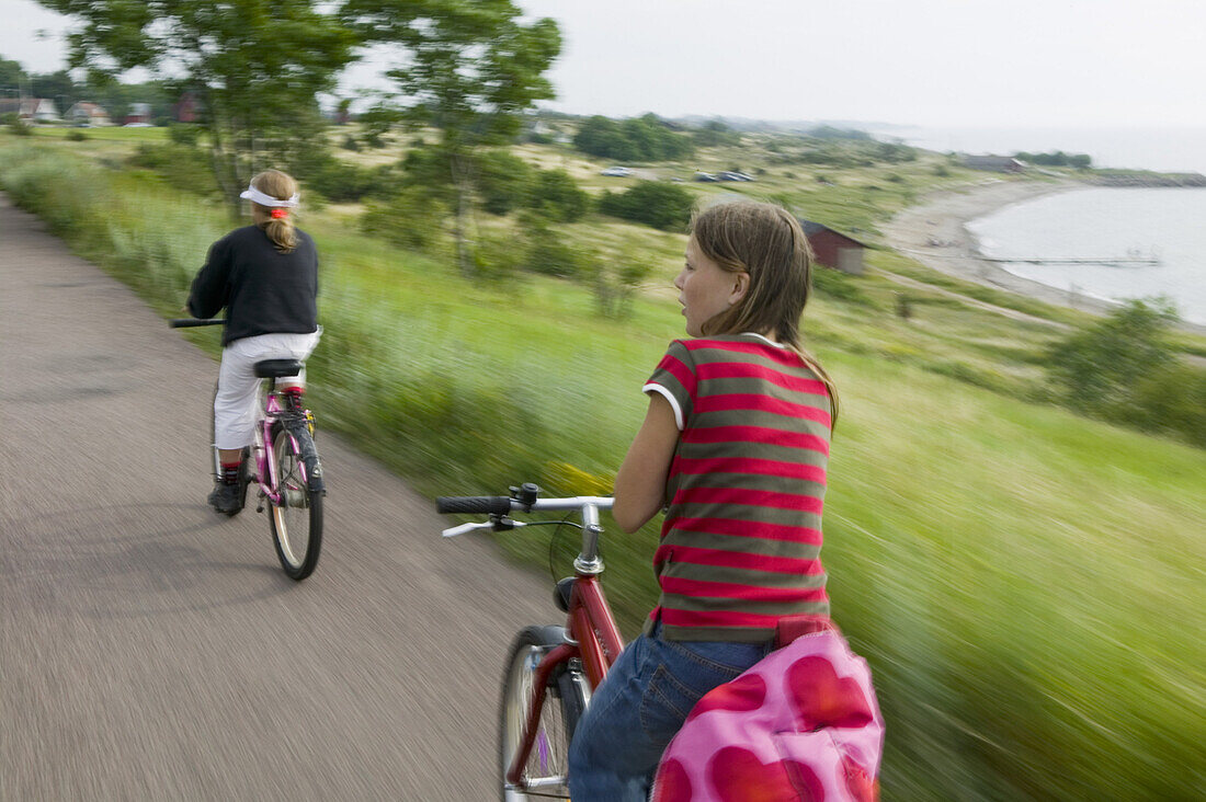 Two girls riding bikes (MR)