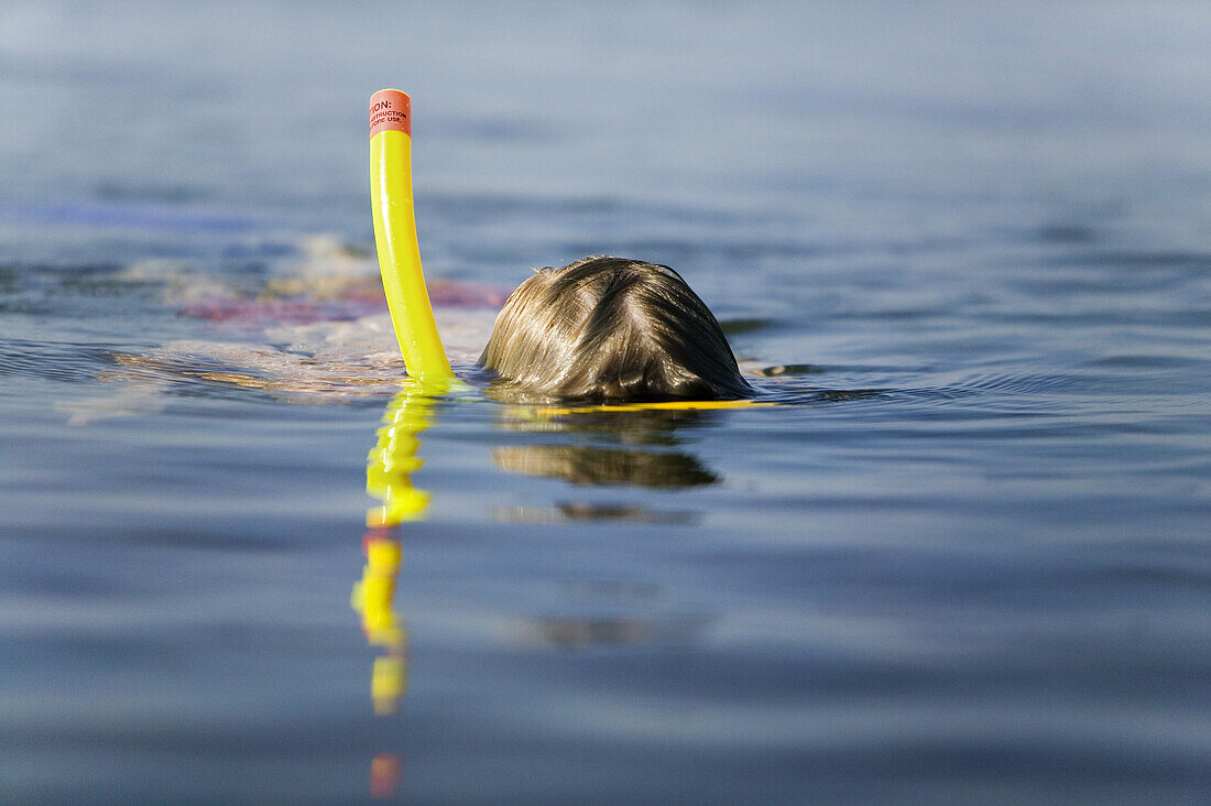 Boy with goggles and snorkel