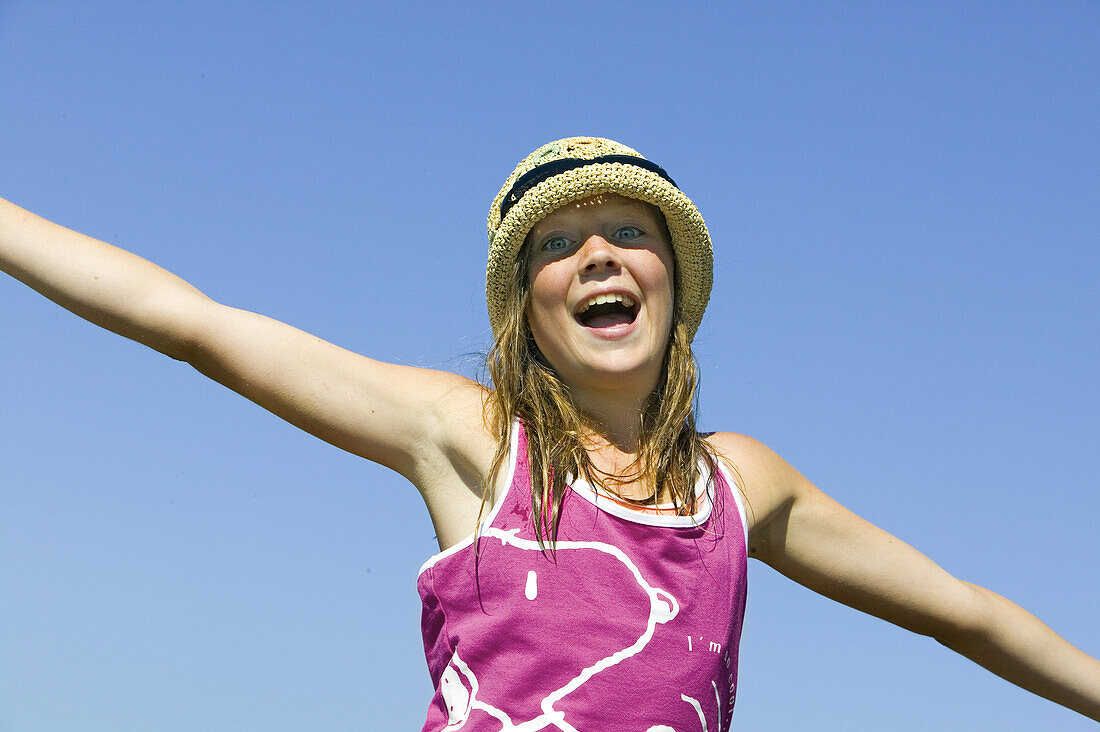 Happy girl with straw hat