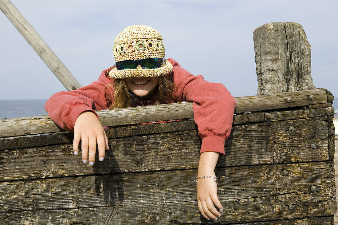 Girl with sunglasses and straw hat