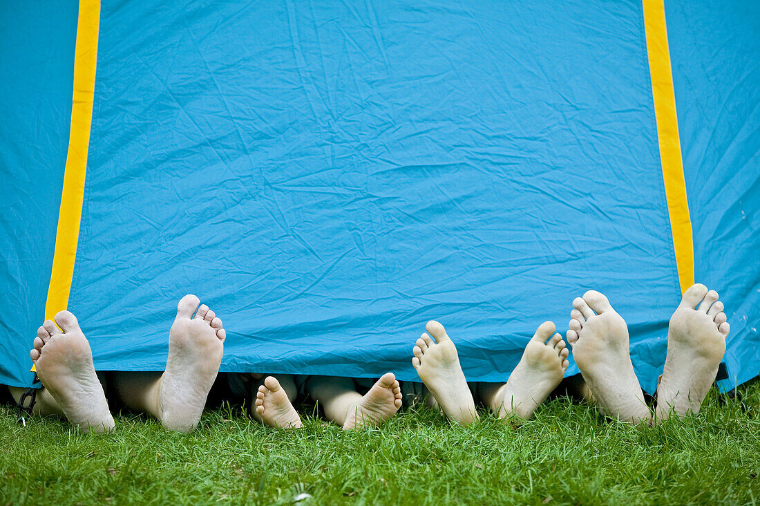 Feet sticks out from a tent