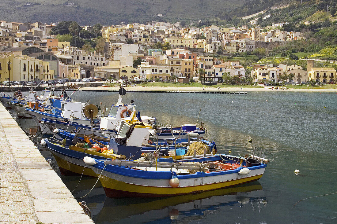Fisherman and boats at harbor Castellammare del Golfo Sicily Italy