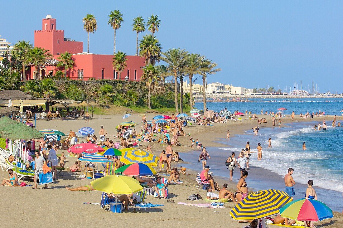 Beach and Bil-Bil castle in background, Benalmadena. Costa del Sol, Malaga province, Andalusia, Spain