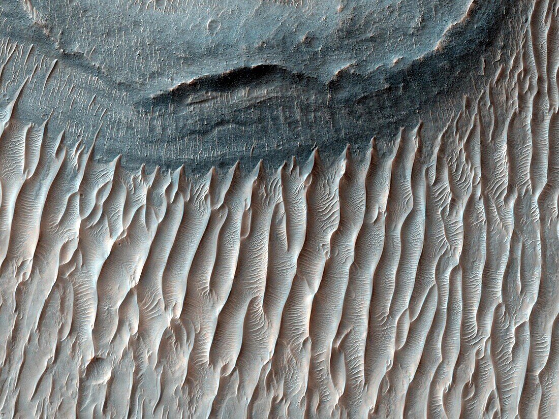 The Red Planet is home to Valles Marineris, the solar system´s largest canyon  Within this canyon lies Ius Chasma  This image, which spans the floor of its southern trench,m was taken by the Mars Reconnaissance Orbiter  The canyon is well-known for its fi