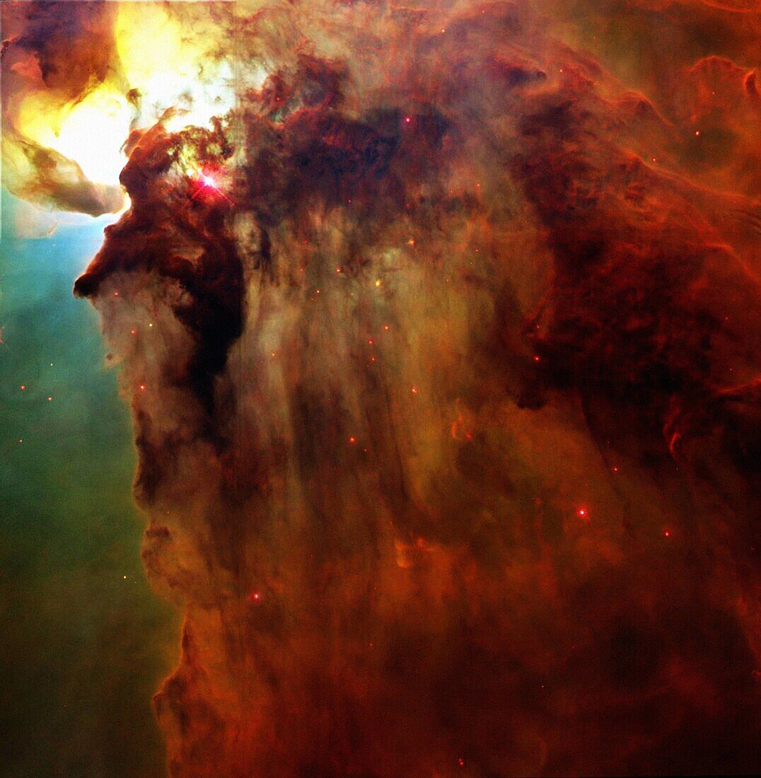 This Hubble Telescope snapshot unveils a pair of one-half, light-year-long interstellar ´twisters´ -- eerie funnels and twisted-rope structures upper left -- in the heart of the Lagoon Nebula M8 which lies 5,000 light-years from Earth in the direction of