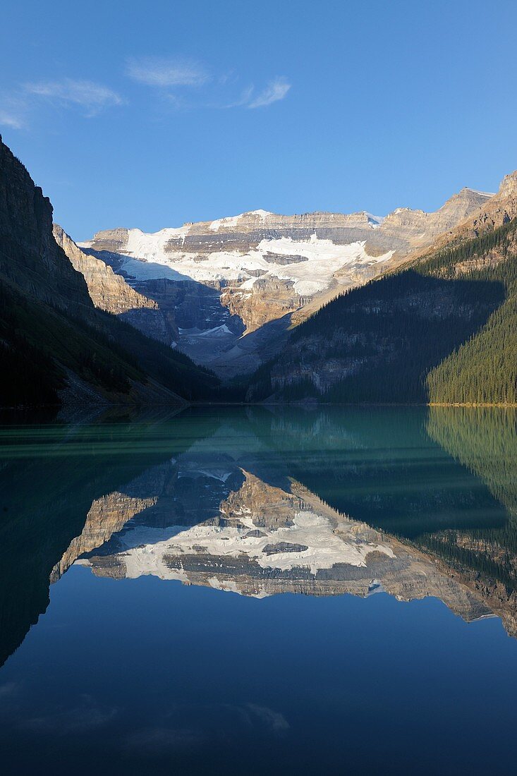 Mount Victoria reflecting in the calm water, Lake Louise, Banff National Park, Rocky Mountains, Alberta, Canada
