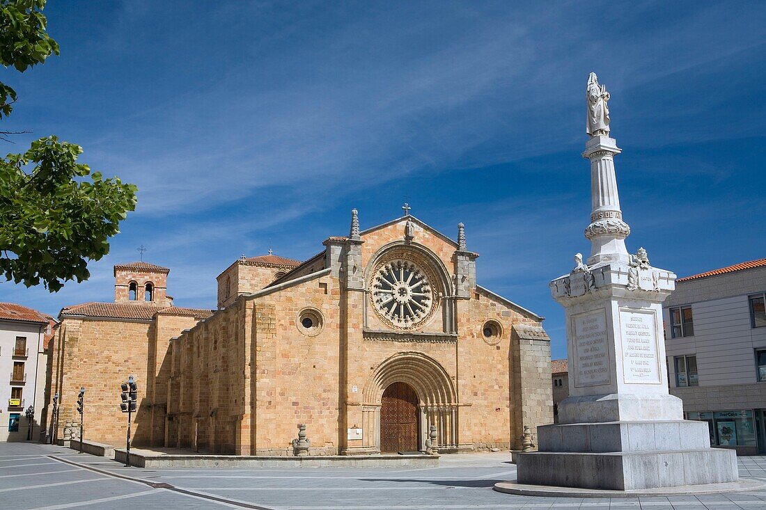 San Pedro church, in romanesque style with a rosette Cistercian, and the Santa Teresa de Jesús statue, in the city of Avila  World Heritage City  Castilla y León, Spain