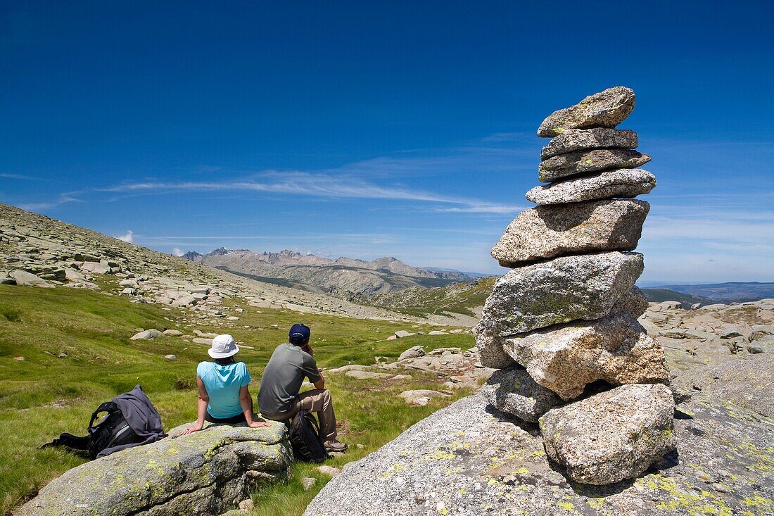Mountaineers practice mountaineering in the mountains of the Sierra de Gredos National Park  At the end of the image the summit of Almanzor peak  Navacepeda de Tormes  Ávila  Castilla y León  Spain