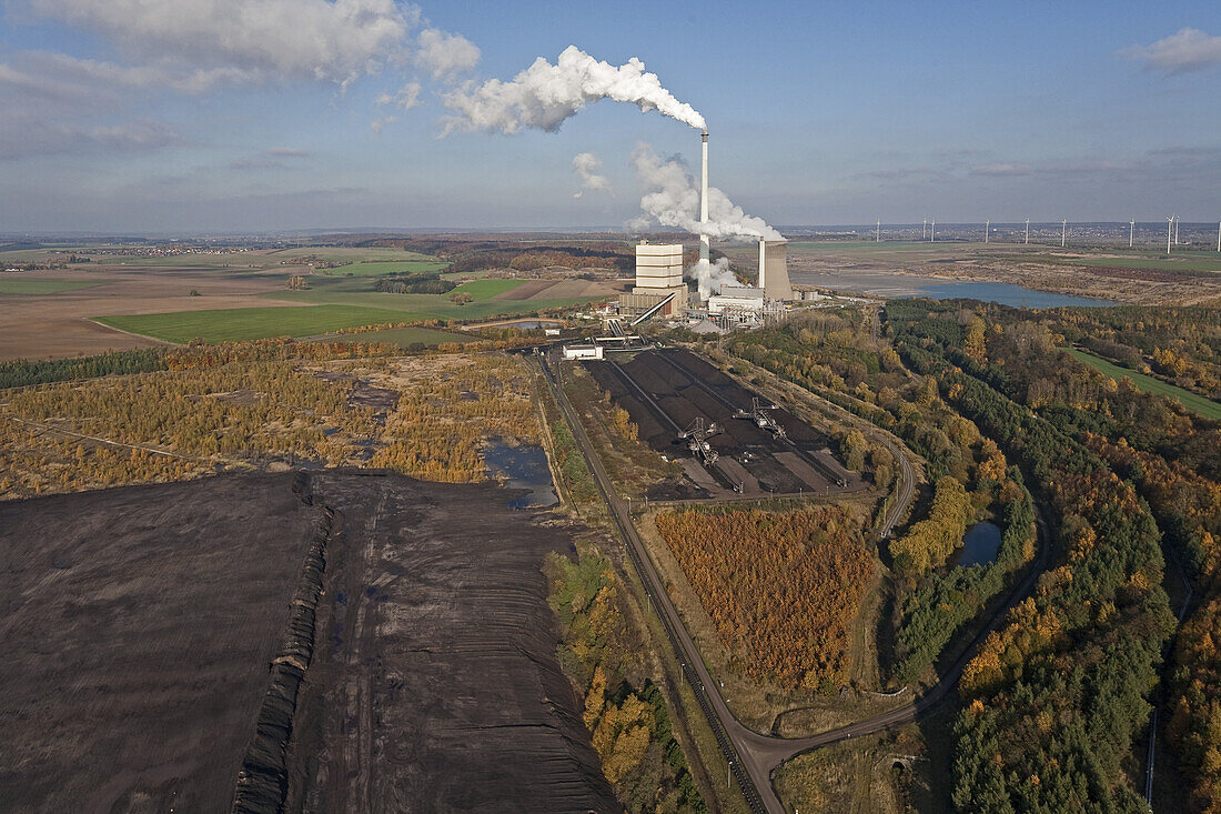 Aerial view of a lignite open-pit mine at  fossil-fuel power station Buschhaus, cooling towers in the background, Helmstedt, Lower Saxony, northern Germany