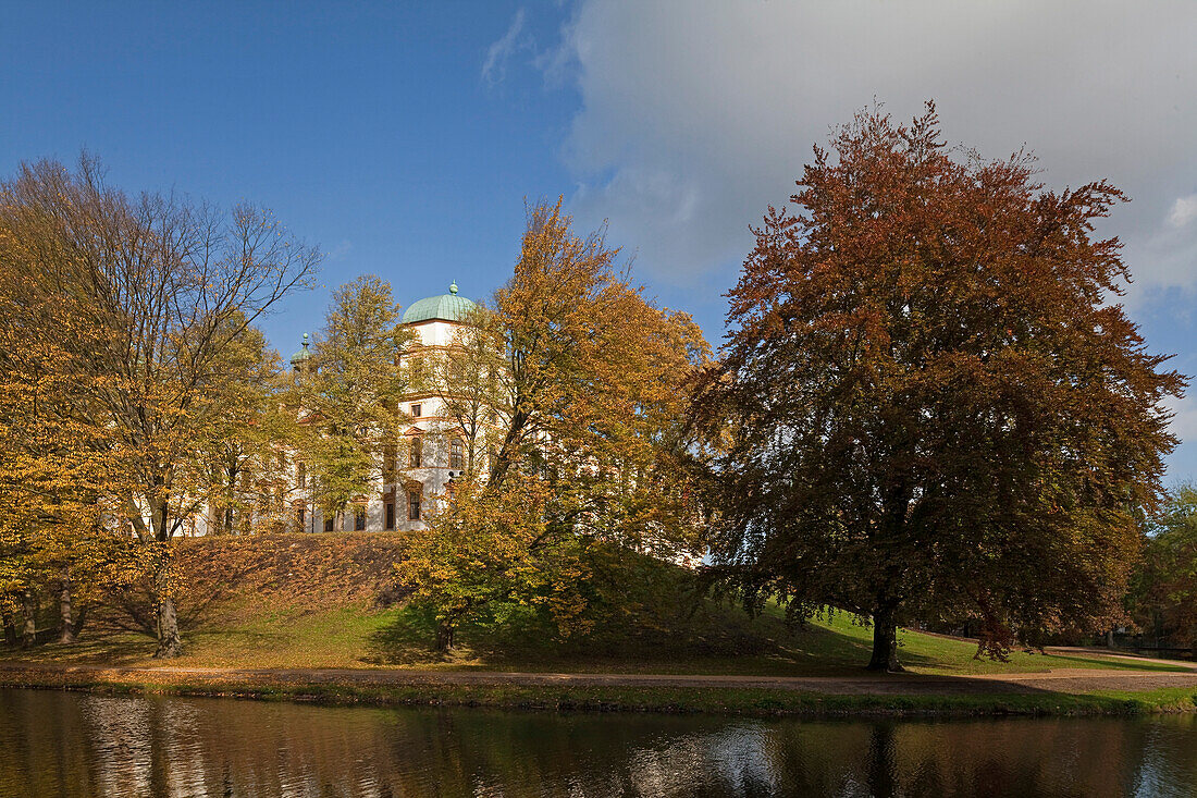 View across the moat towards Celle castle, Castle grounds in Autumn colours, Celle, Lower Saxony, northern Germany