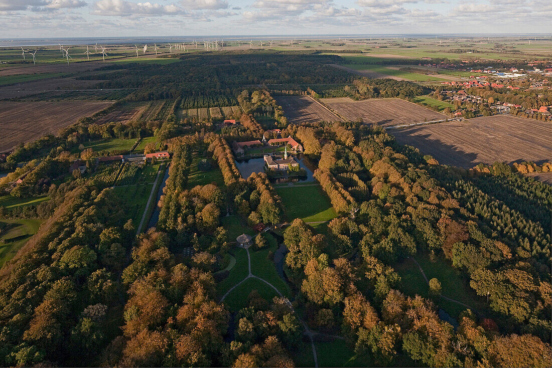 Aerial shot Lutetsburg castle, wind farm in background, Lutetsburg, Lower Saxony, Germany