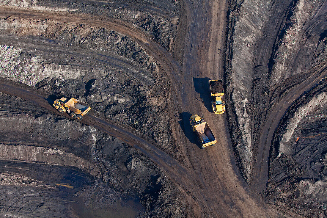 Aerial view of an open-pit lignite mine, Lorries transporting brown coal, Schöningen, Lower Saxony, Germany
