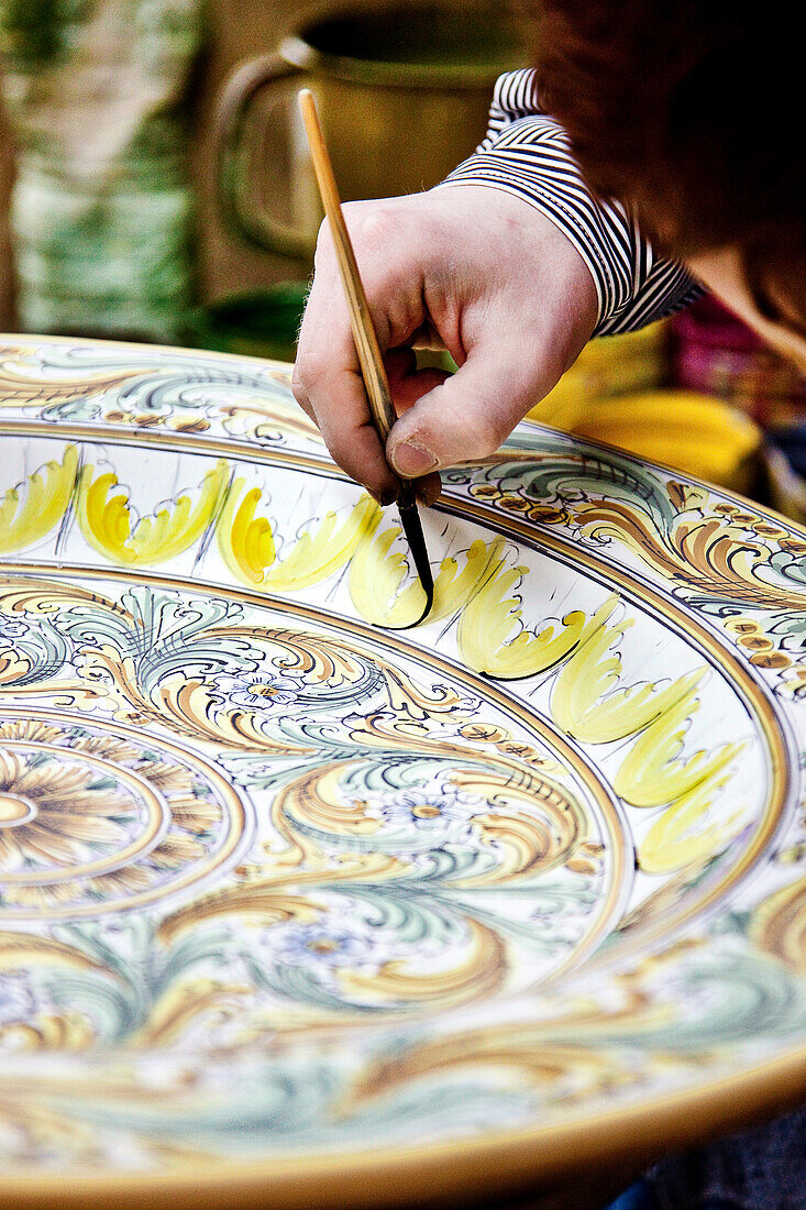 Women painting pottery, Caltegirone, Sicily, Italy