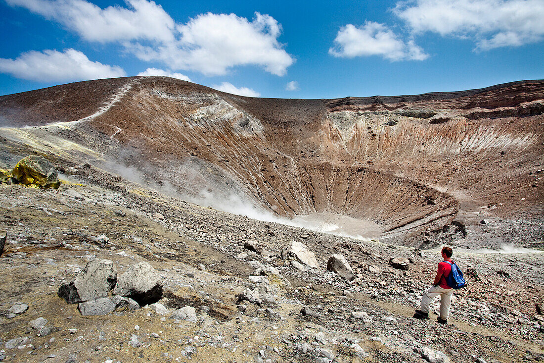 Hiker at the vulcono crater, Vulcano Island, Aeolian islands, Sicily, Italy