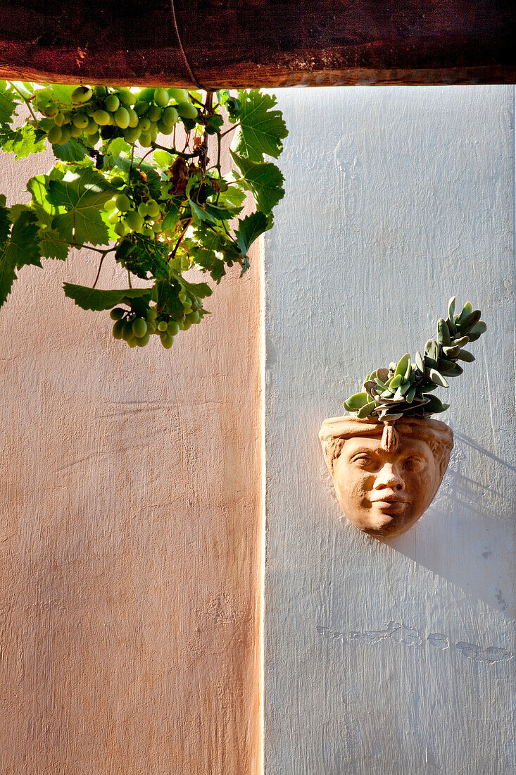 Sculpture on wall, Hotel Signum, Malfa, Salina Island, Aeolian islands, Sicily, Italy