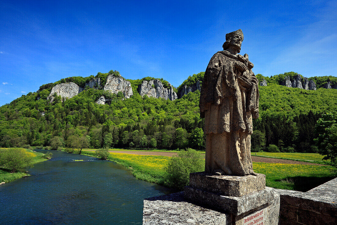 Sculpture of St. Nepomuk on the Danube bridge near Hausen, Upper Danube nature park, Danube river, Baden-Württemberg, Germany