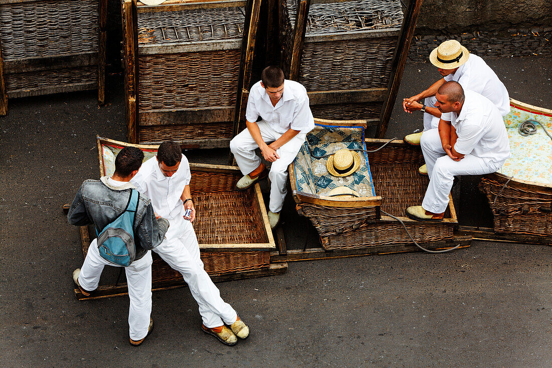 Wicker basket toboggans with their guides, sledges in Monte, Funchal, Madeira, Portugal