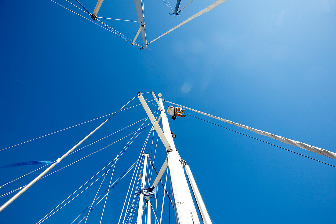 Low angle view at a sailor at the mast of a sailing boat, Croatia, Europe