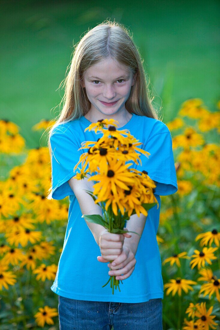 girl with bouquet of black eyed susans