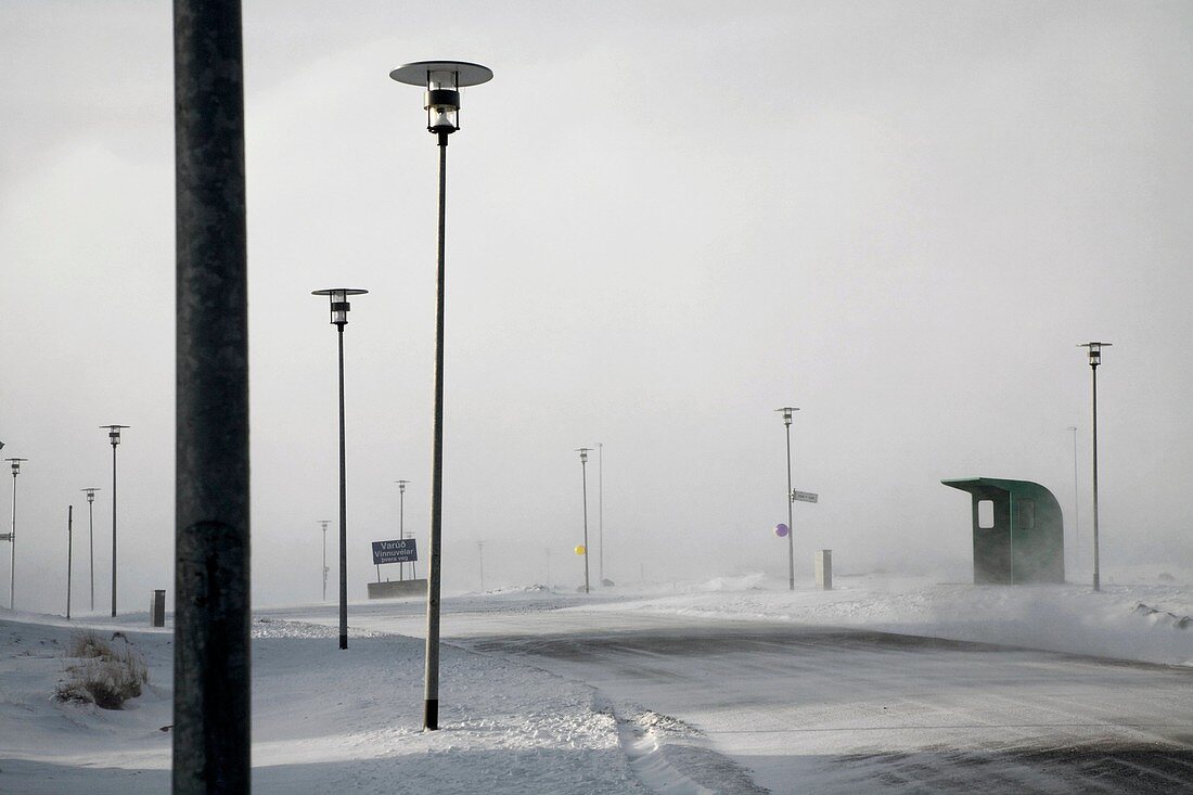 Bus stop in suburban landscape during snow storm  Leirvogstunga, Mosfellsbaer town, Iceland  Construction of new houses is under threat due to the financial crisis in Iceland