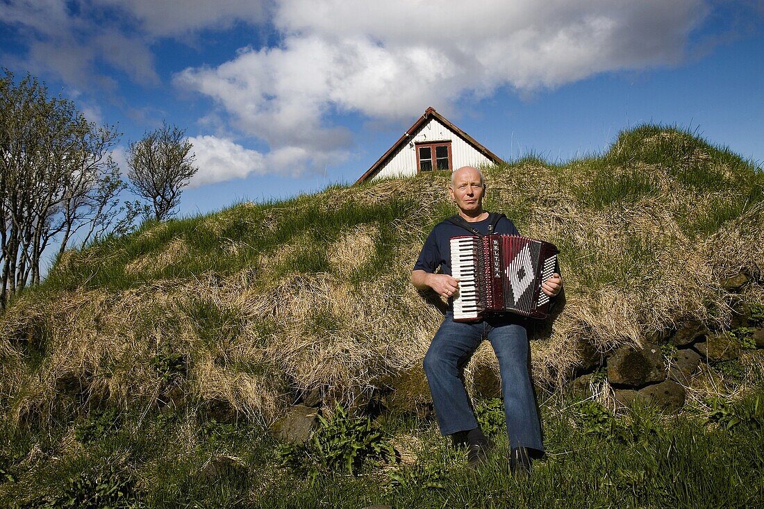 Farmer play accordion  Iceland