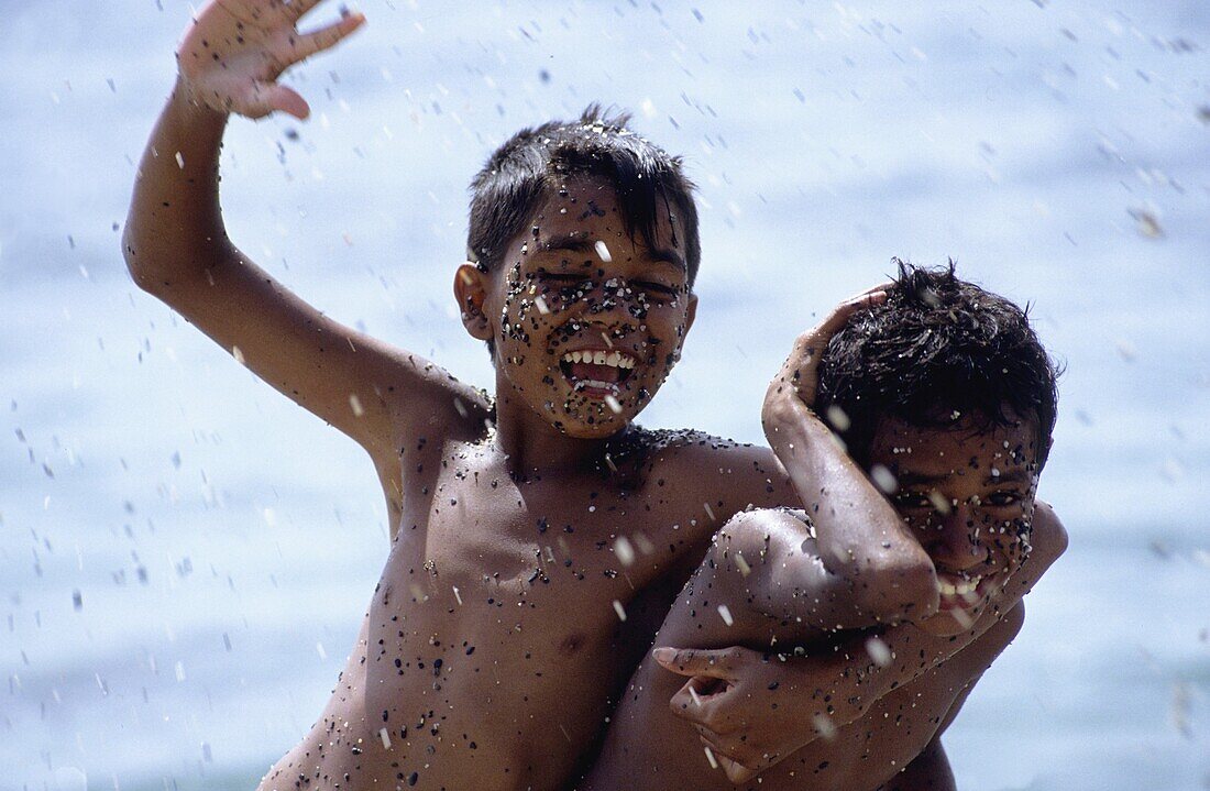 Children playing in the sea  Ceram islandAmahai  Moluccas island  Indonesia