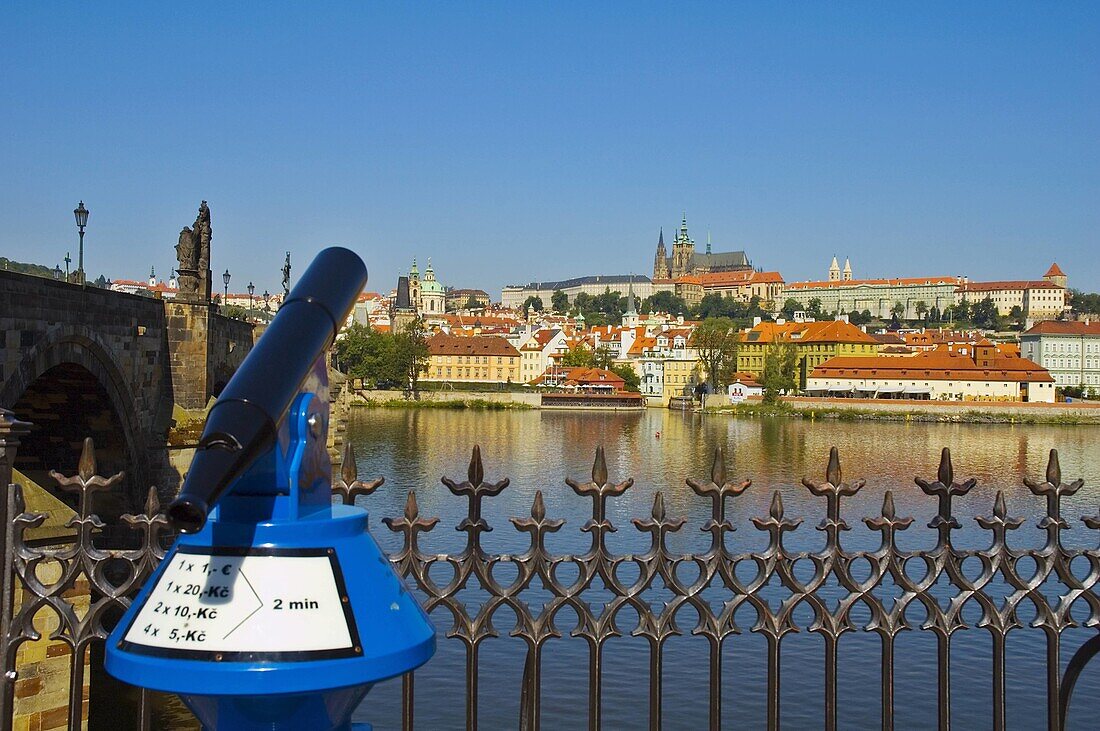 Binoculars looking over River Vltava towards Mala Strana and castle in central Prague Czech Republic EU