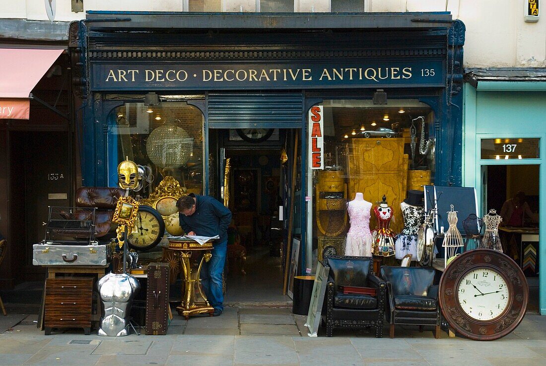 Shop selling decorative antiques along Portobello Road West London England UK