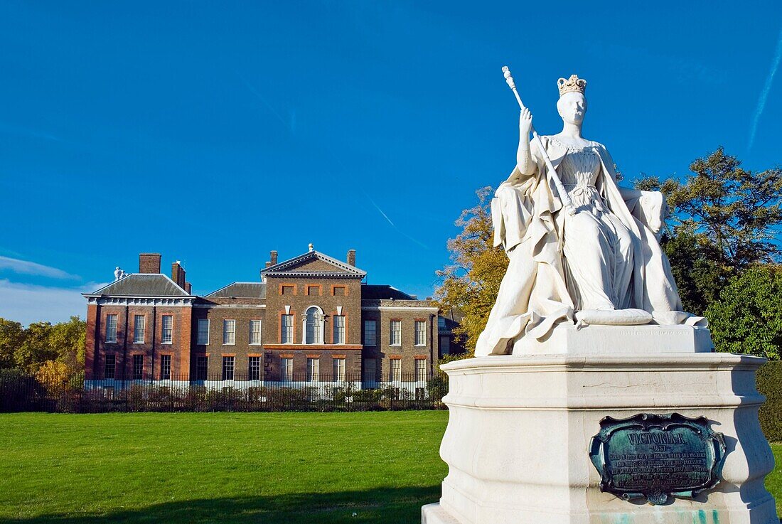 Statue of Queen Victoria in front of Kensington Palace in Kensington Gardens west London England UK