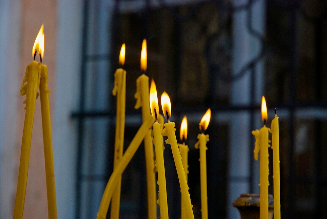 Lit candles outside Sveti Dimitrija orthodox church in Carsija district of Skopje Macedonia Europe