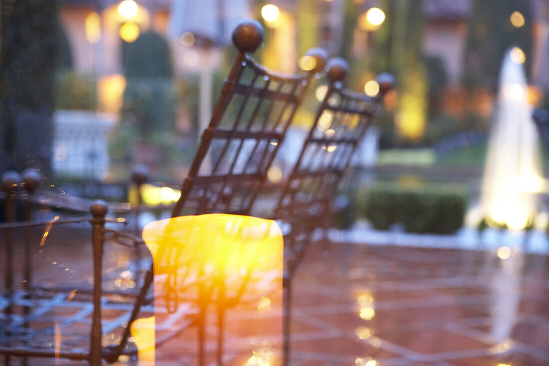 View into the yard and cafe through the window in the evening, Hotel Giardino, Ascona, Ticino, Switzerland