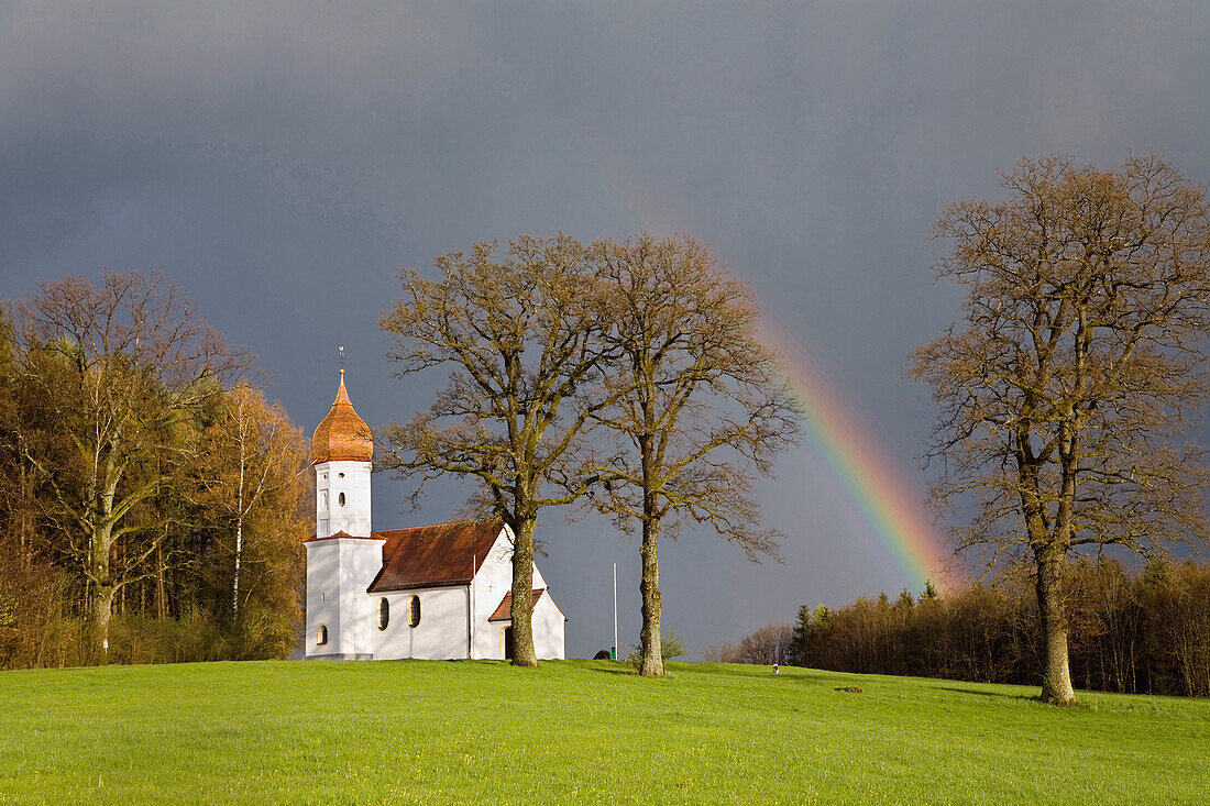 Chapel with rainbow in Upper Bavaria, Germany