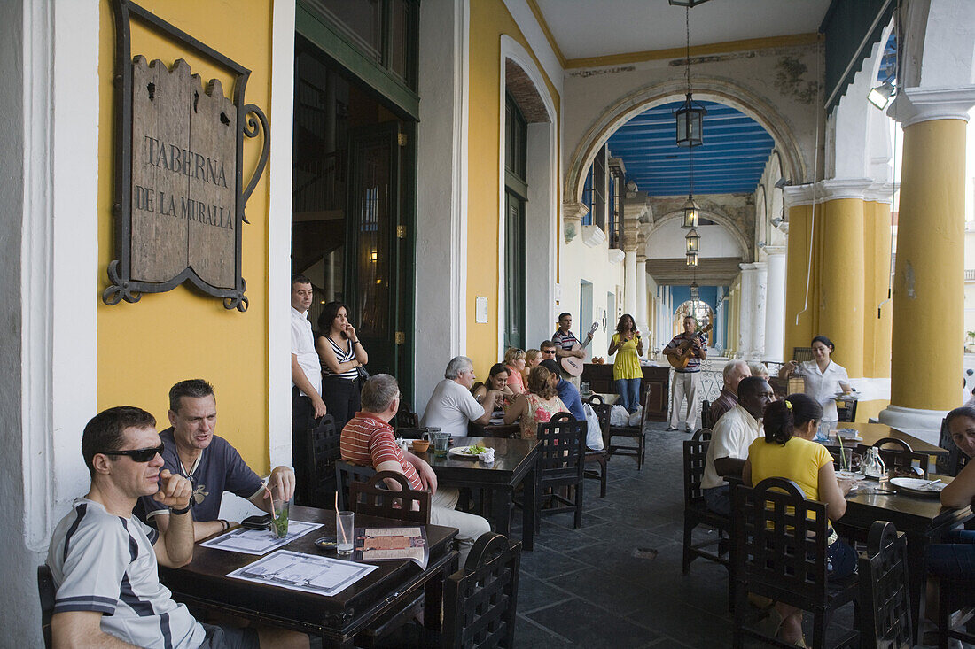 People seated outdoors at Taberna de la Muralla Brewery Bar and Restaurant, Havana, Cuba
