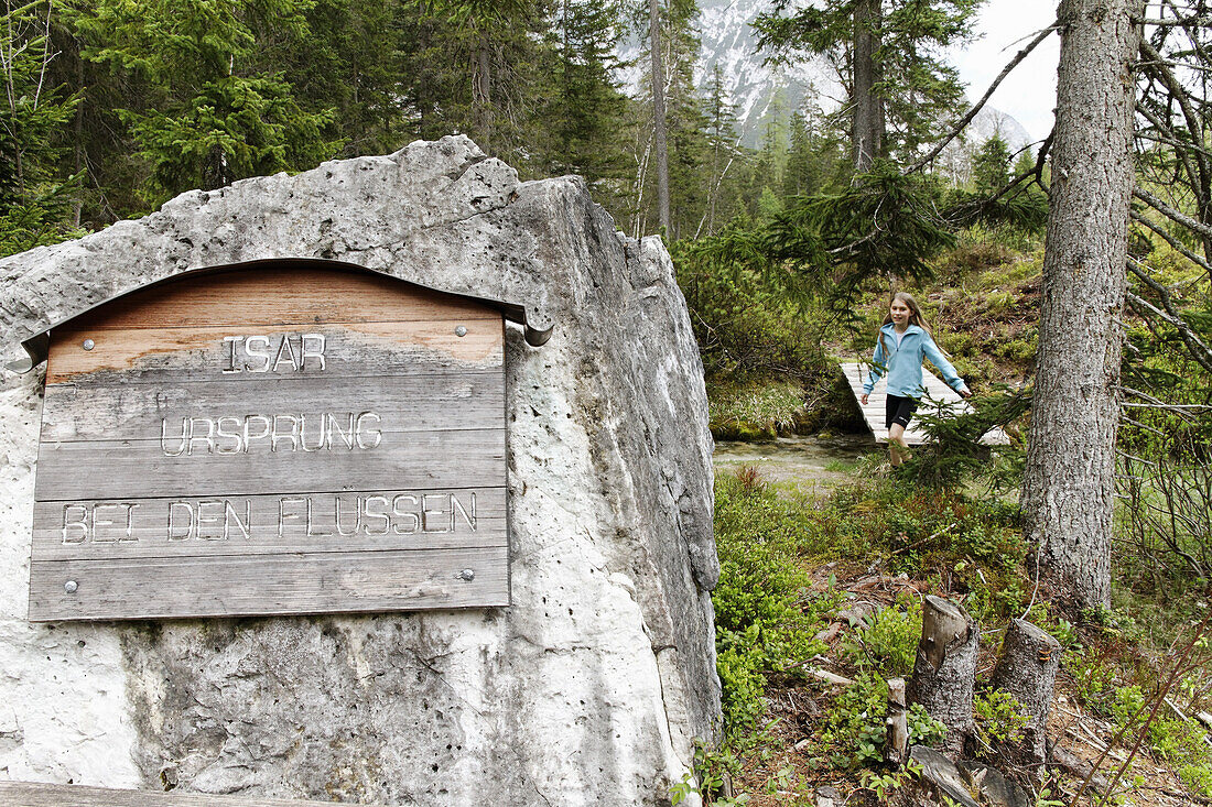 Girl at Isar river source, Hinterau valley, Isar Cycle Route, Karwendel range, Tyrol, Austria