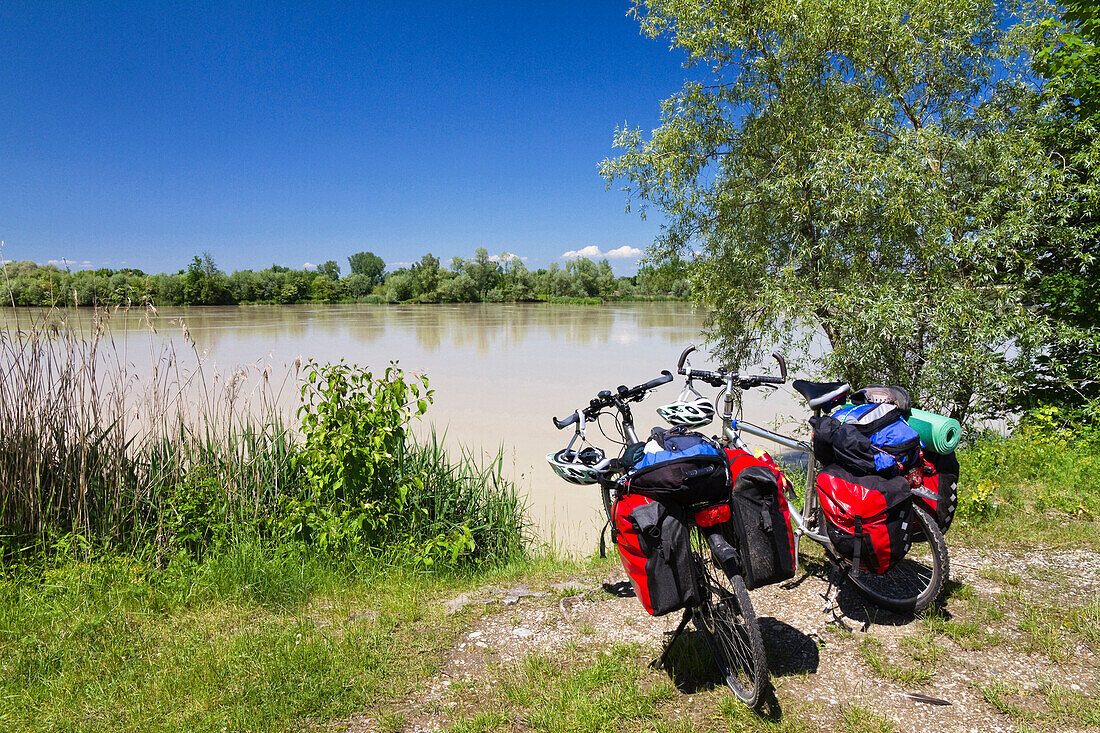 Bicycles with saddle-bags near Isar River bank, Landau, Isar Cycle Route, Lower Bavaria, Germany