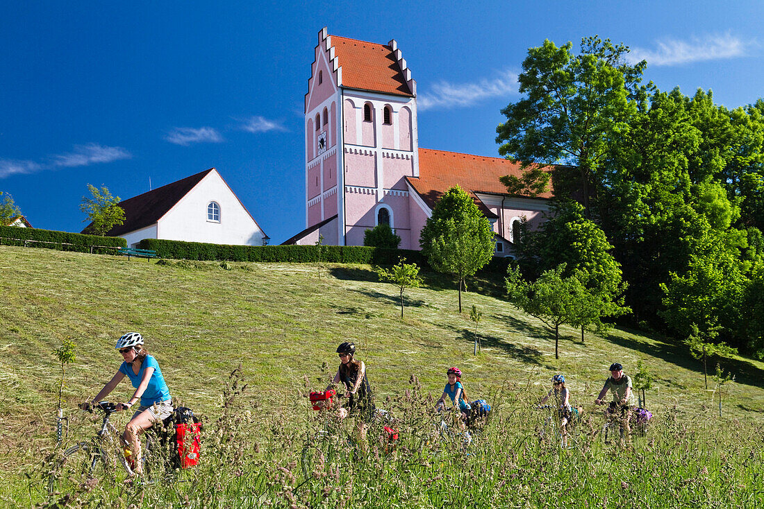 Cyclists passing Isar Cycle Route, near Niederporing, Lower Bavaria, Germany