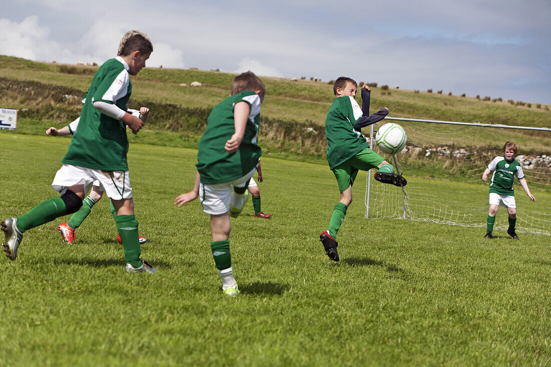 Young boys playing football, County Clare