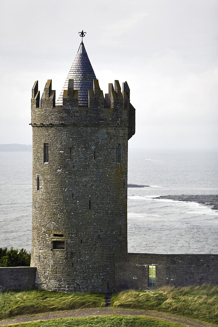 Doonagore Castle with a view at the Bay of Liscannor, County Clare