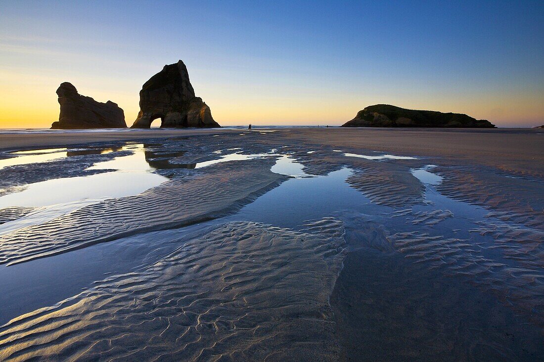 Rippled Sand and rock formations at Wharariki Beach, Nelson, North Island, New Zealand